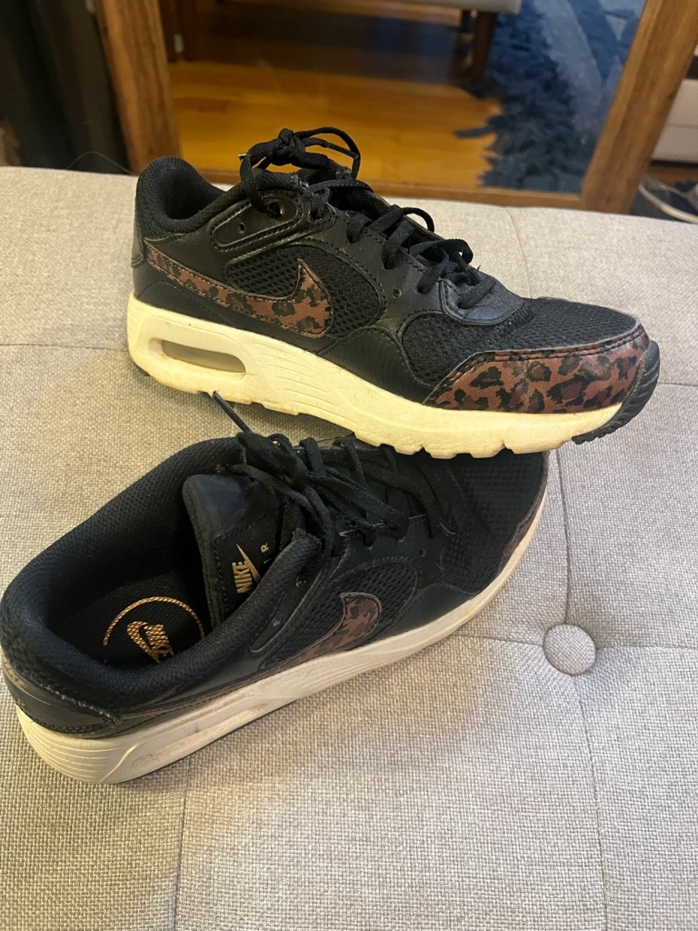 Nike Air Women’s 7  Black with gold and cheetah swoosh.